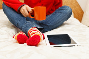 coffee and cozy socks with tablet
